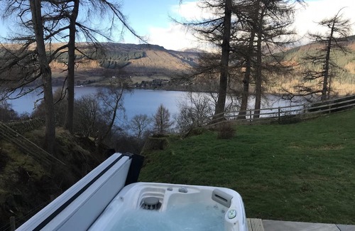 Loch Tay House | Luxury waterfall cottage with private hot tub at Loch Tay