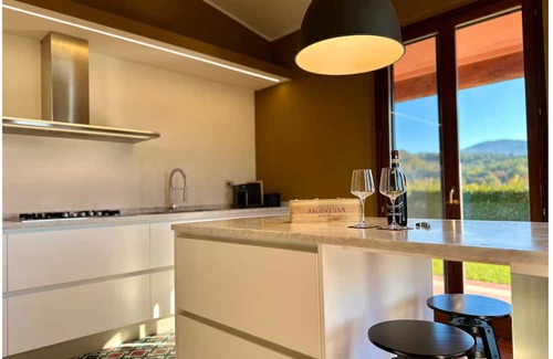 Pieve al Bagnoro House | An oasis of peace and warmth of home, amidst thoughtful design and views toward the hills.