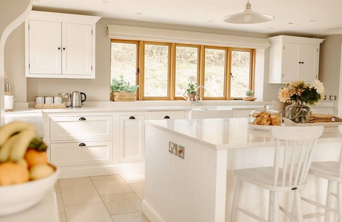 Acrefair House | A luxurious riverside cottage with stunning views, a hot tub, and fishing access.