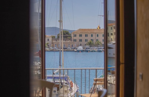 Portoferraio Old Town Apartment | Tastefully furnished, it consists of a family room with a double bed and a single bed, a small livin