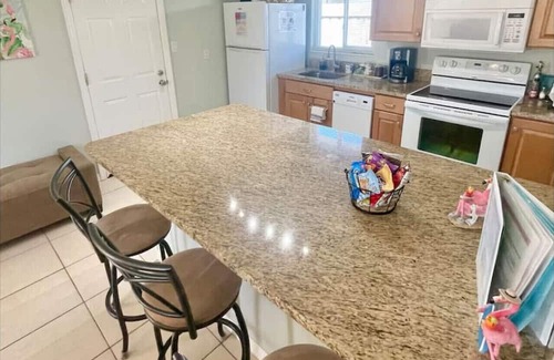 Cocoa Beach House | Fiesta Flamingo Cottage: Your Cocoa Beach Paradise with Kayaks & Bikes