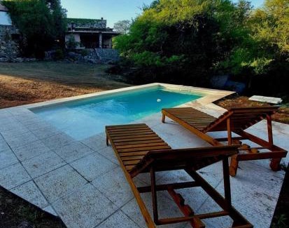 Falda del Carmen Villa | Casa de Piedra