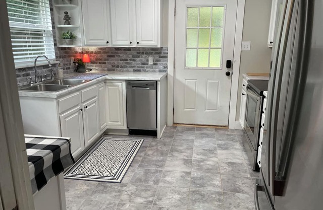 Cozy cottage in Birmingham with wooded yard and close to interstate.