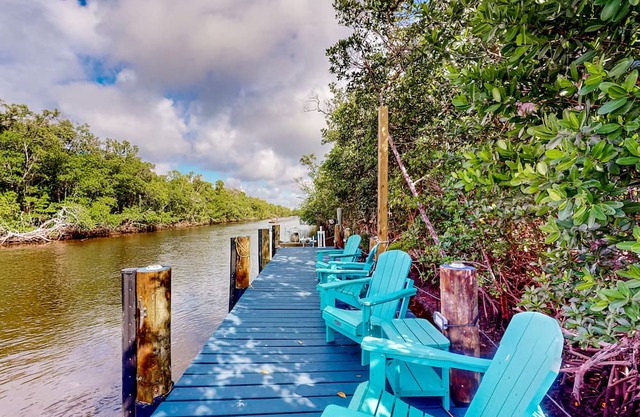 Colorful riverfront retreat with large patio, pier, & great views - dog-friendly