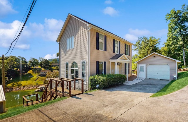 Stunning lake front home w/dock, card tables, wet bar, fire pit & amazing views!