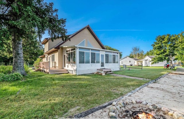Marvelous updated 4-bedroom lake house in Gaylord with sunset views and a beach