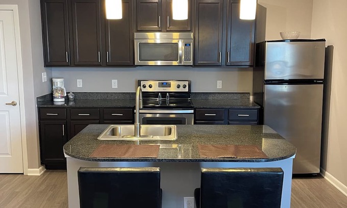 Polaris Apartment | Right at Polaris! 3rd floor w/elevator access and garage parking included!