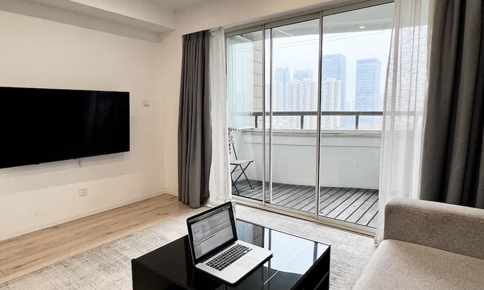 Huaihai Road Commercial Area Apartment | peaceful urban retreat in a stylish minimal apartment with views across the city