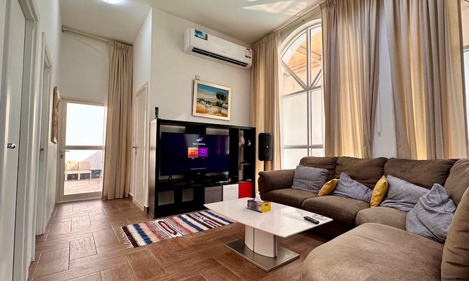Doha Apartment | Heart of Doha Elegant Home with Shared Swimming Pool