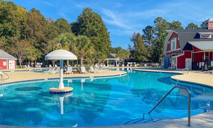 Carolina Forest House | Charming & sunlit retreat with pool, patio, courts, & gym - near golf & beaches, dog-friendly